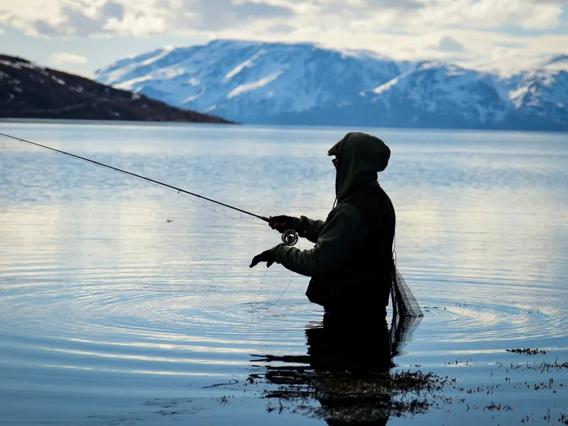 Wading the fjord, snow still on the mountains behind