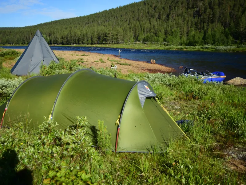 Camp on the bank: tents up, river right there